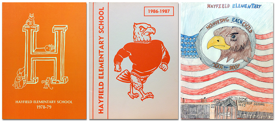 Collage showing the covers of three Hayfield Elementary School yearbooks. On the left is the cover of the 1978 to 1979 yearbook. It is an orange cover with a three-dimensional letter H printed in white, and small cartoon figures of an owl, a dog, and a mouse. At center is the cover of our 1986 to 1987 yearbook. It is a white cover with an illustration of our mascot, the hawk, printed in orange. On the right is the cover of our 2006 to 2007 yearbook. It features a full-color student-drawn illustration of a hawk inside a circle. The circle has text that reads: Honoring each child. The circle is set above an American flag. Beneath the flag is an illustration of the front of our building. 